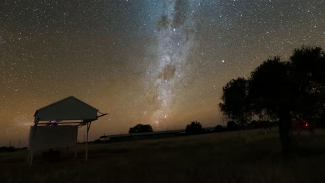 time-lapse of the milky way galaxy with tracking over the astrofarm in namibia with beautiful view for the night sky with really dark and clear sky.