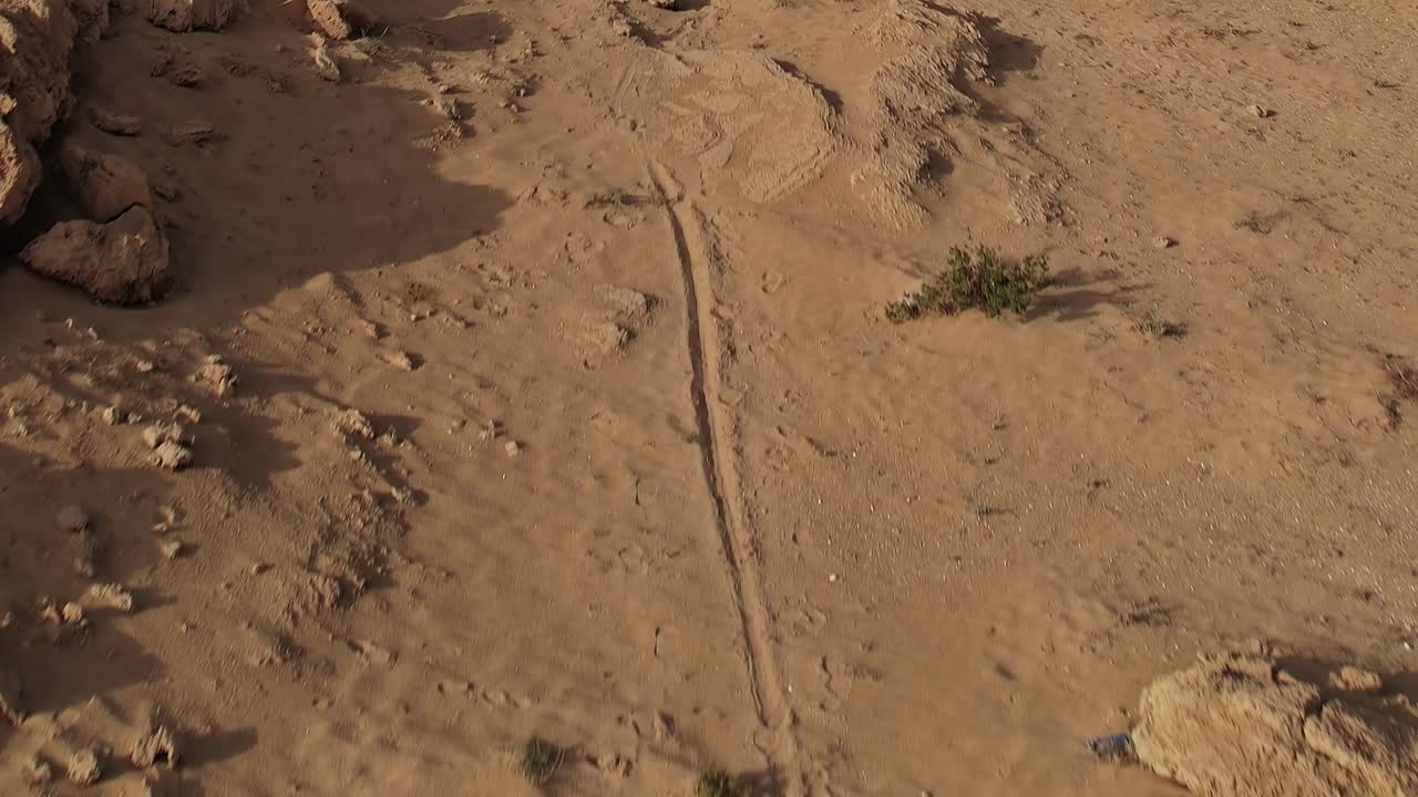 Aerial view of desert landscape in Morocco with sparse vegetation
