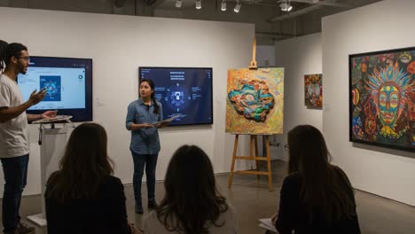 art presentation in gallery: engaging discussion on creative works and artistic techniques with an audience in a contemporary setting
