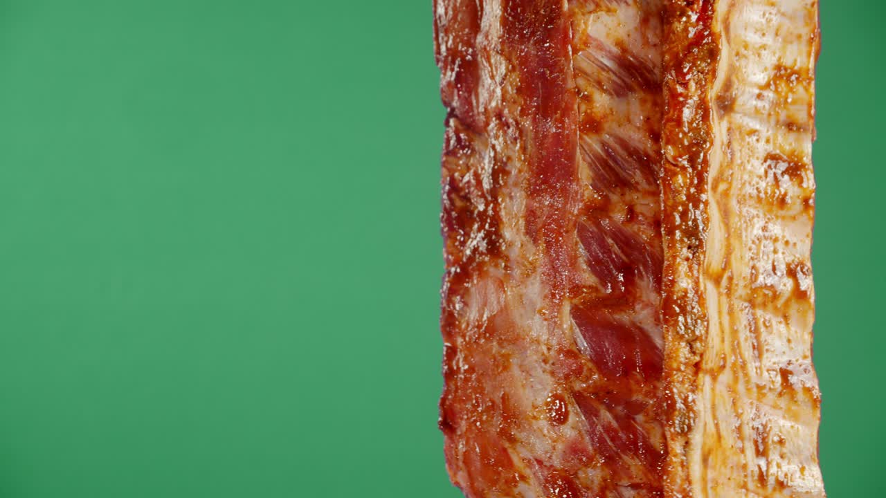 Raw ribs in tomato sauce hang.