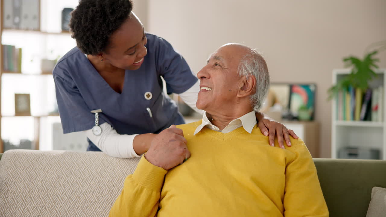 Elderly man receiving care from a caregiver