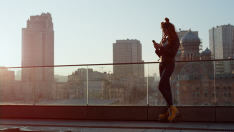 Stylish-woman-using-phone-outside.-Beautiful-girl-looking-to-cellphone-outdoor.