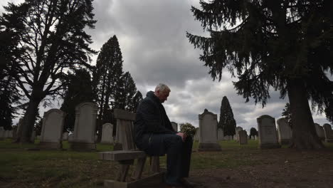 lonely man at cemetery