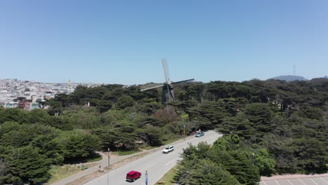 low push-in aerial shot of the dutch windmill in golden gate park, san francisco