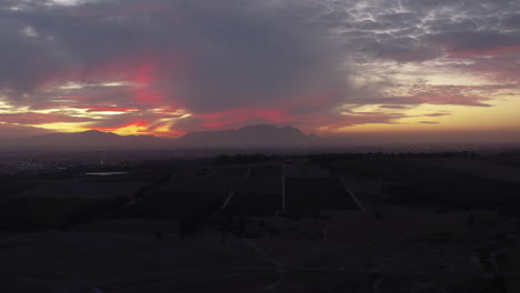 pink sunset drone shot from stellenbosch of cape town, south africa