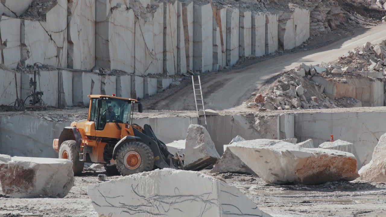 Loader Transporting Stone in Quarry
