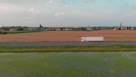 aerial view of a highway(autostrada) in italy amid fields.