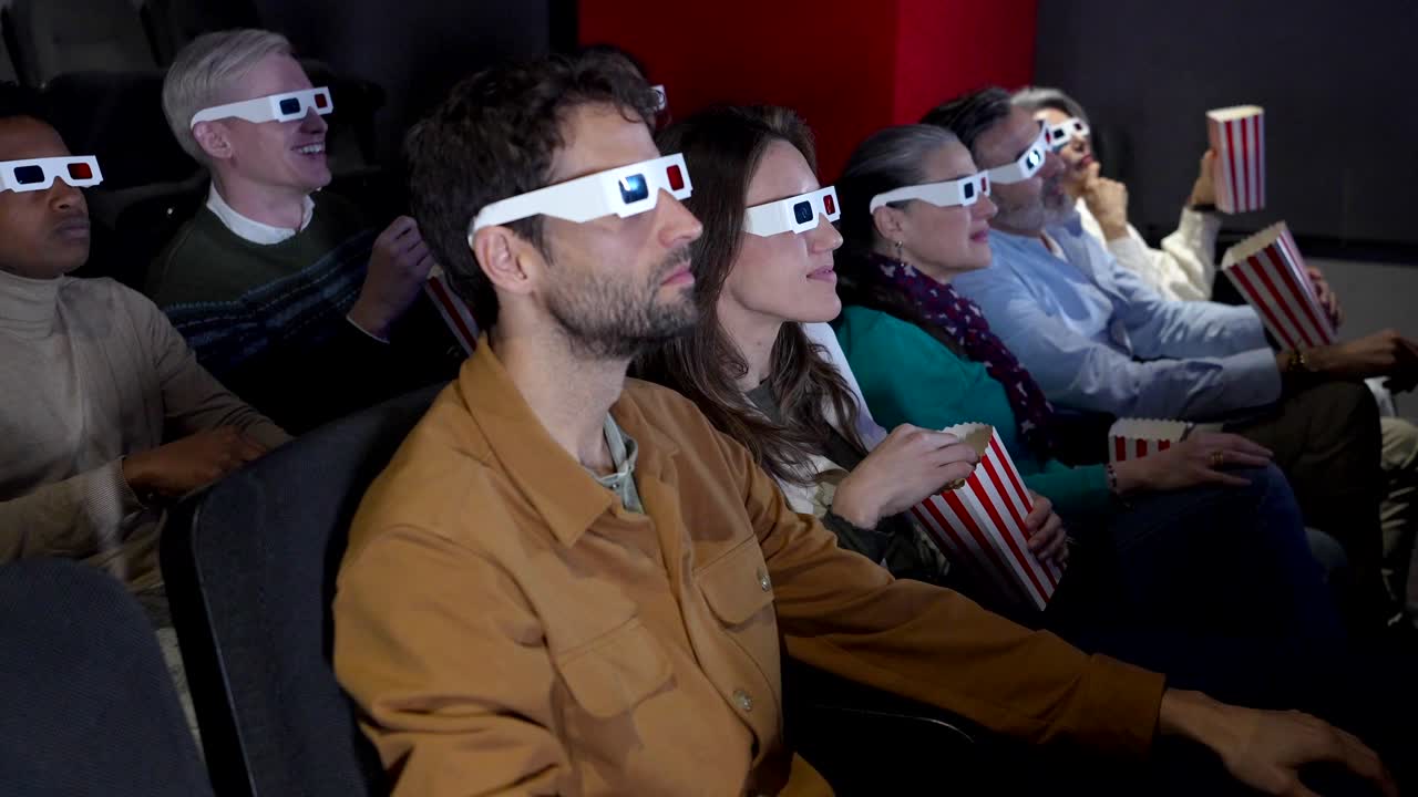 People Enjoying a Movie at the Cinema with 3D Glasses