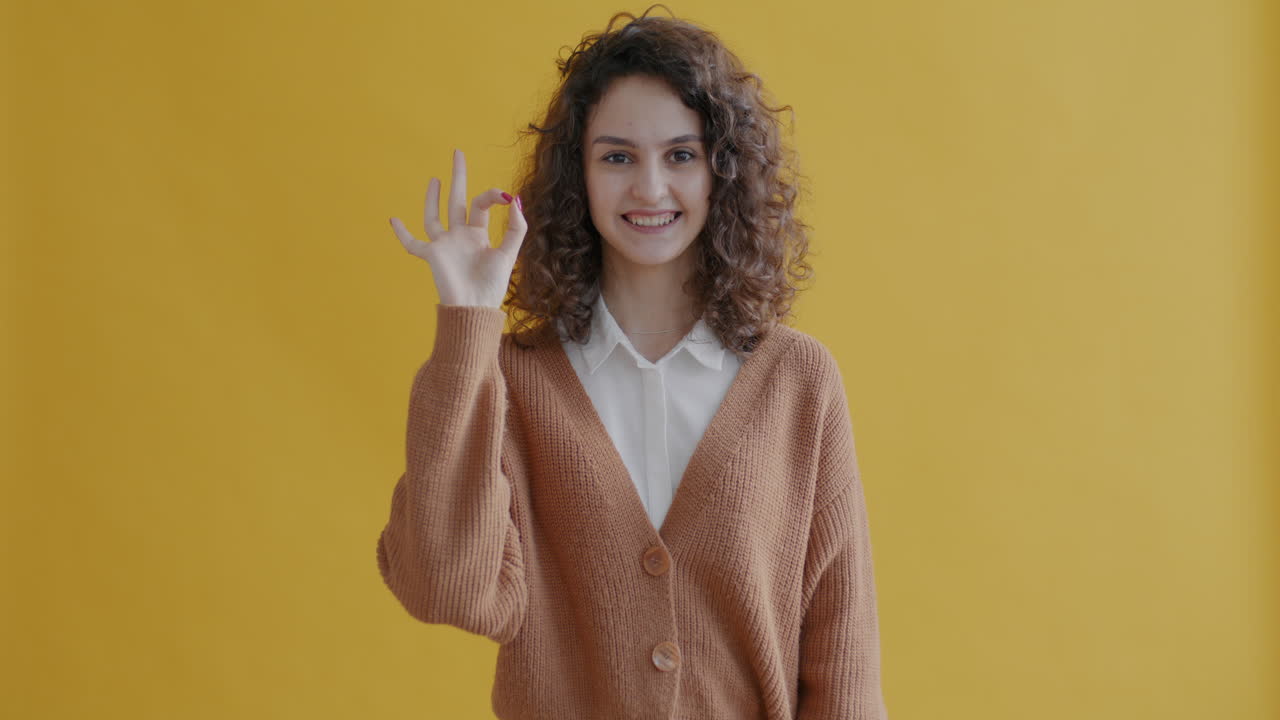 Young Woman Making an Ok Gesture