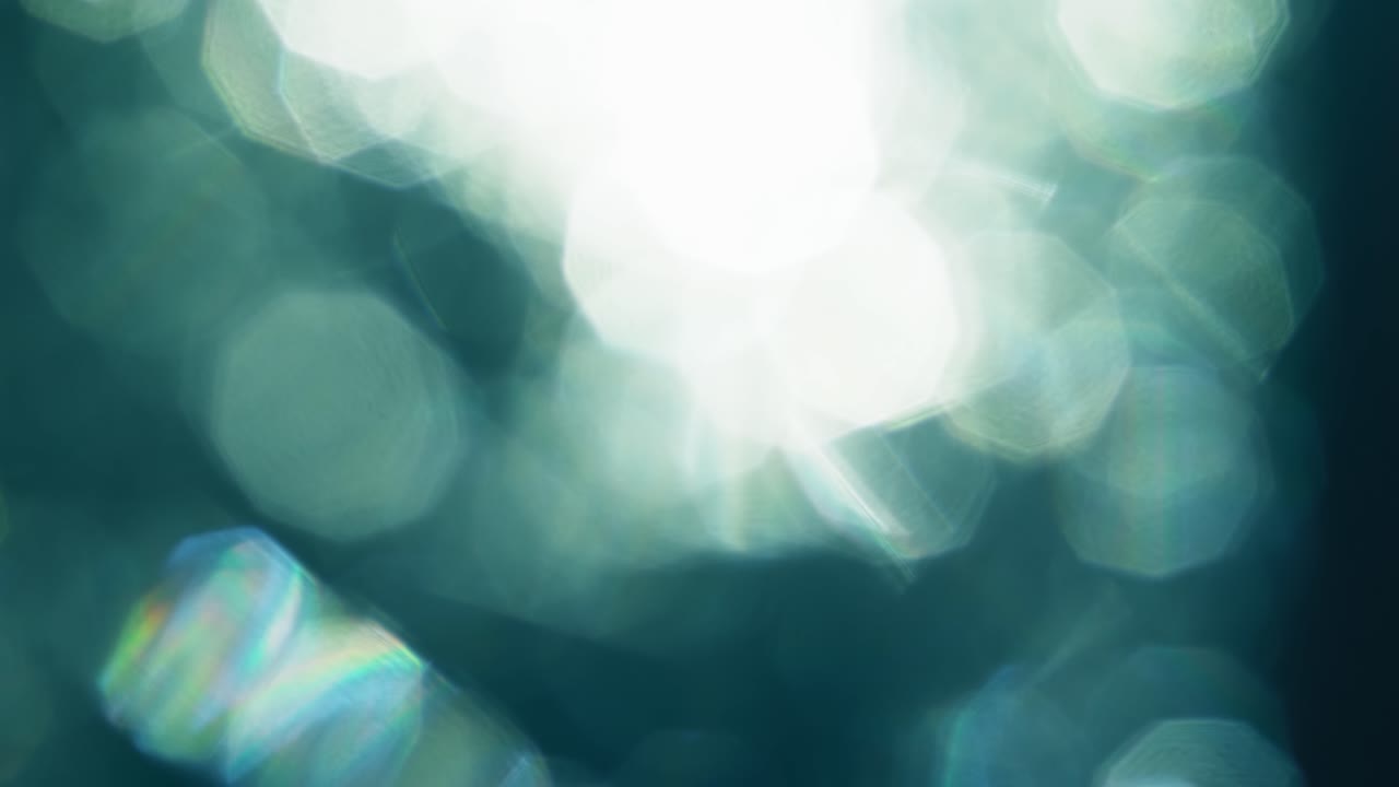 Dynamic Teal and White Light Leaks and Bokeh Overlay