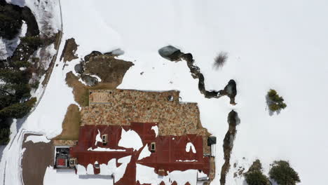 Massive-luxury-estate-in-winter-season,-aerial-top-down-view