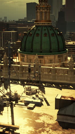 a view of the city from the rooftop of a building with a golden dome