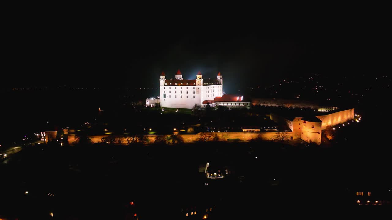 4K cinematic drone shot of Bratislava Castle illuminated at night — Slovakia_04
