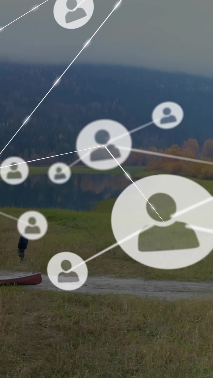 Vertical video: Man walking shore path, user icons emerging near him and visualizing tech network