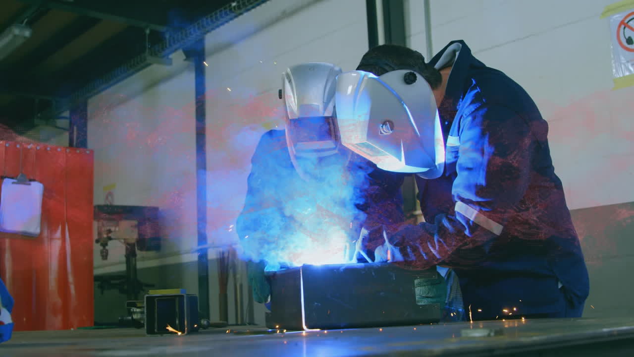 Animation of dna strand spinning over male engineers welding