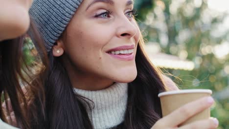 handheld view of two women with a cup of coffee