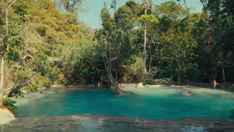 stunning turquoise waterfall in a lush tropical forest