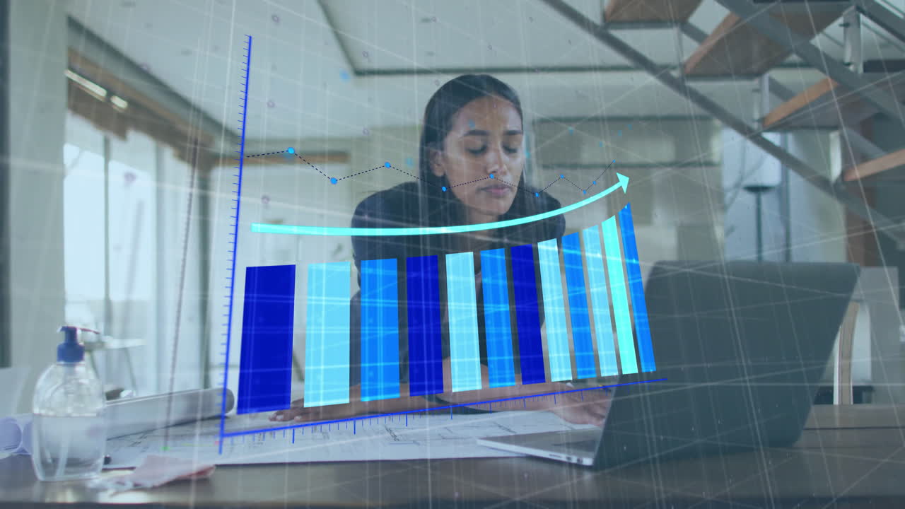 Working on laptop, businesswoman analyzing financial graph animation in office