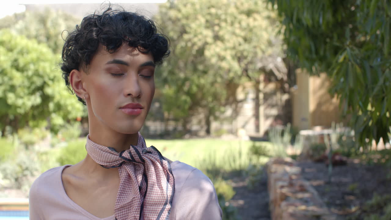 Relaxing outdoors, person with scarf enjoying peaceful moment in garden