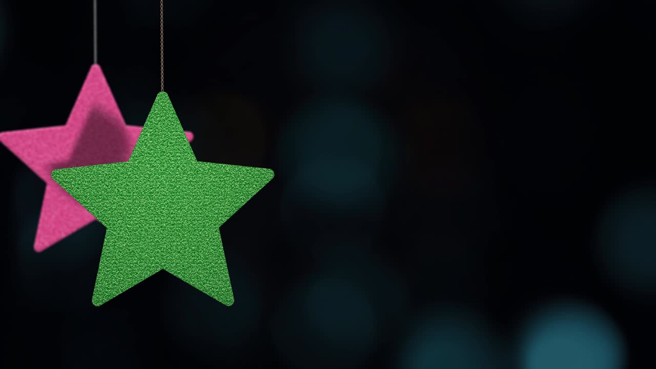 los adornos de las estrellas de navidad se mueven en el fondo de bokeh.