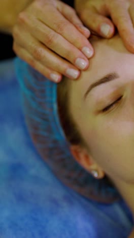 relaxing beautiful woman having a massage on a face