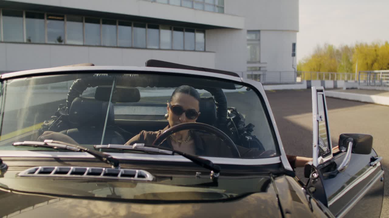 Woman Driving a Classic Convertible