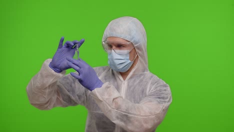 doctor in ppe suit with vaccine ampoule in hands offering vaccination against coronavirus pandemic