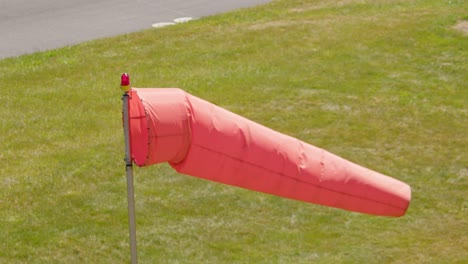 high angle view of an airport windsock blowing in strong wind