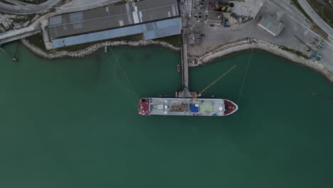 4k aerial drone container ship docked in port raša rasa in trget