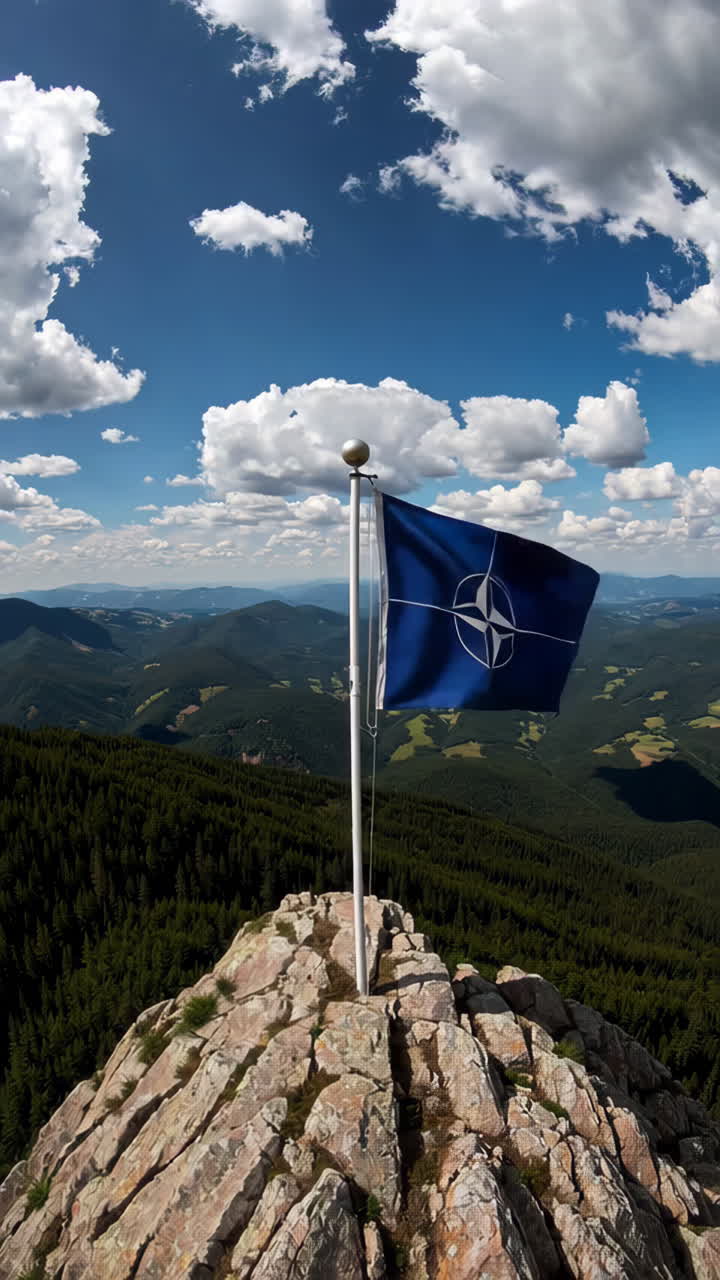 NATO Flag on Mountain Summit