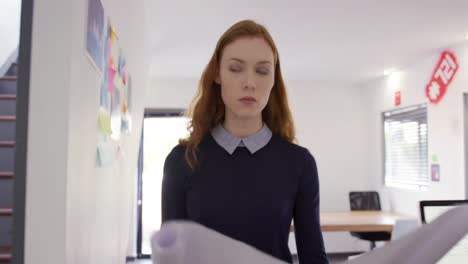 caucasian woman working in creative office