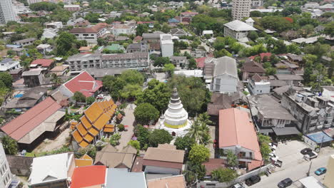 ancient wat ket karam buddhist temple along ping river in chiang mai, thailand. aerial drone shot