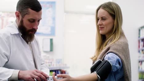 pharmacist checking blood pressure