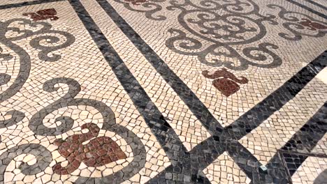 exploring the streets adorned with historic pavement art in portugal