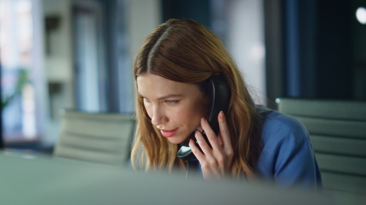 Business manager answering telephone sitting workspace closeup. Help desk worker