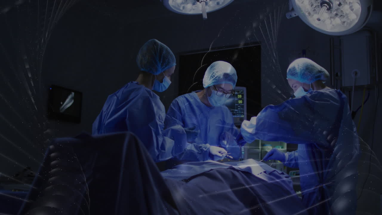 Performing surgery, surgeons in operating room under bright surgical lights