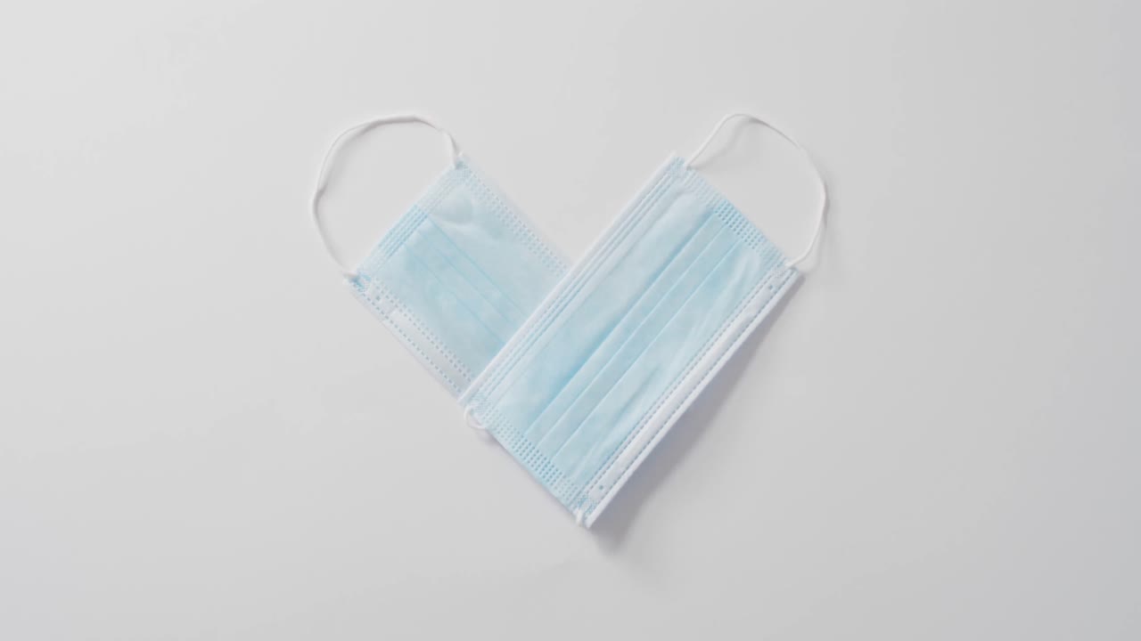 Heart shape face masks on white background at valentine's day
