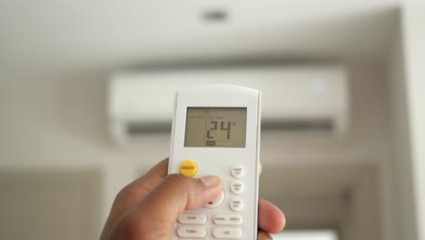 adjusting air conditioner temperature