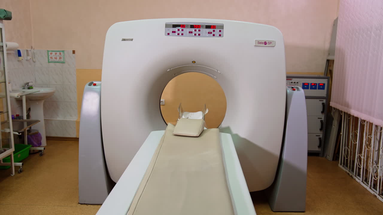 CT scanner with numbers on the display on. Hospital room for magnetic resonance diagnostics.