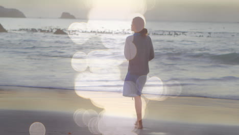 video of lights over biracial woman walking in nature