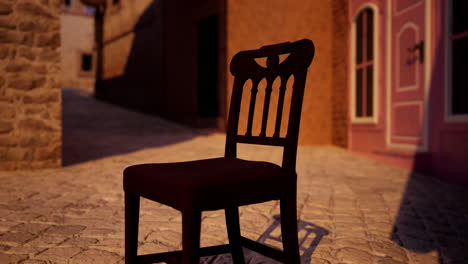 a chair on an empty street in a medieval town