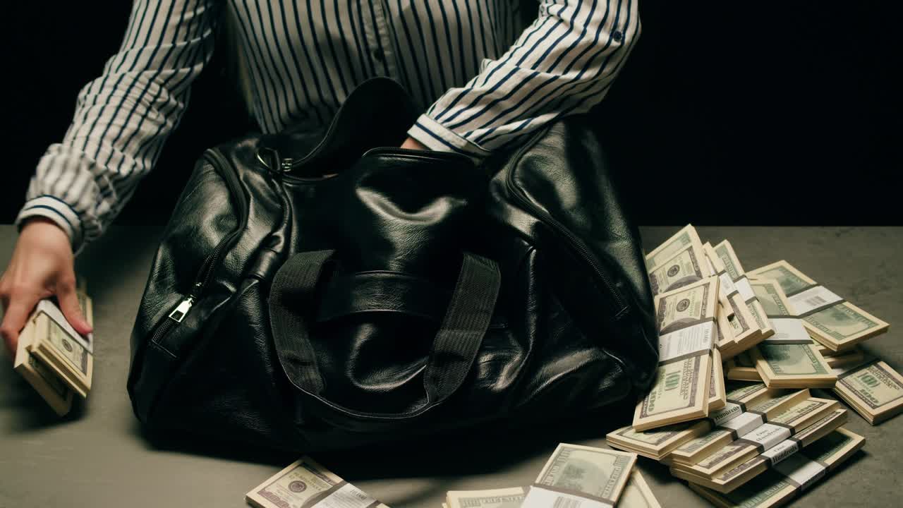 Specialised police officer Counting dollar banknotes in crime lab, conceptual image. High quality 4k footage