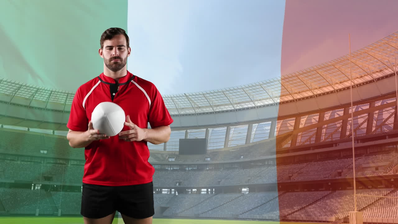 jugador de rugby profesional de pie frente a una bandera y un estadio