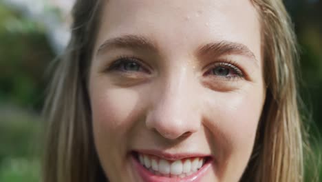 portrait of happy caucasian woman on sunny day at wedding