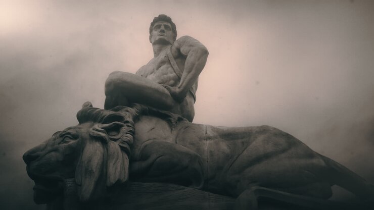 Epic, ancient stone statue on cloudy day and windy weather.