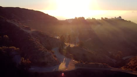 obersvatory in grifftih park in los angeles california with the sunrise in the background