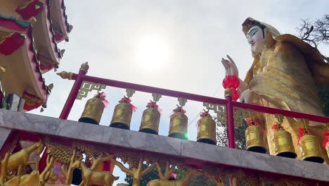 statue and temple architecture under bright sunlight