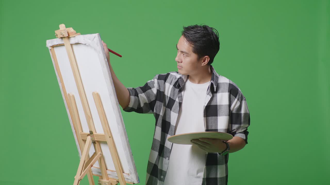 Man Painting on Easel