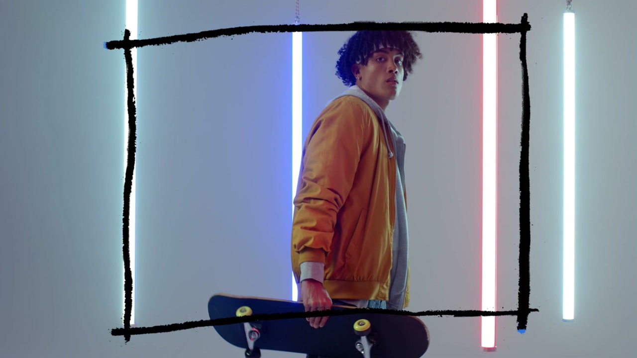 Camera pulling back and rising, skateboarder shifting, lifting board, showcasing gear and neon