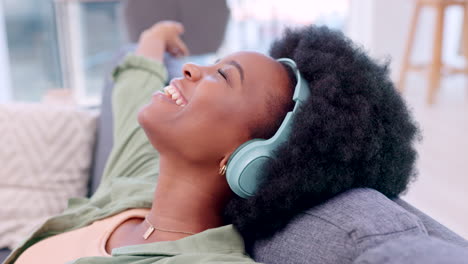 Happy-and-cheerful-and-singing-woman-listening-to